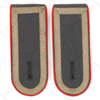 Front detail of German Bundeswehr Stabsunteroffizier shoulder boards showing red piping and tan military tresse.