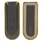 Front and back view of German Bundeswehr Stabsunteroffizier shoulder boards showing yellow piping and attachment tabs.