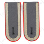 German military shoulder boards for Unteroffizier with red piping details and woven grey tresse strips.