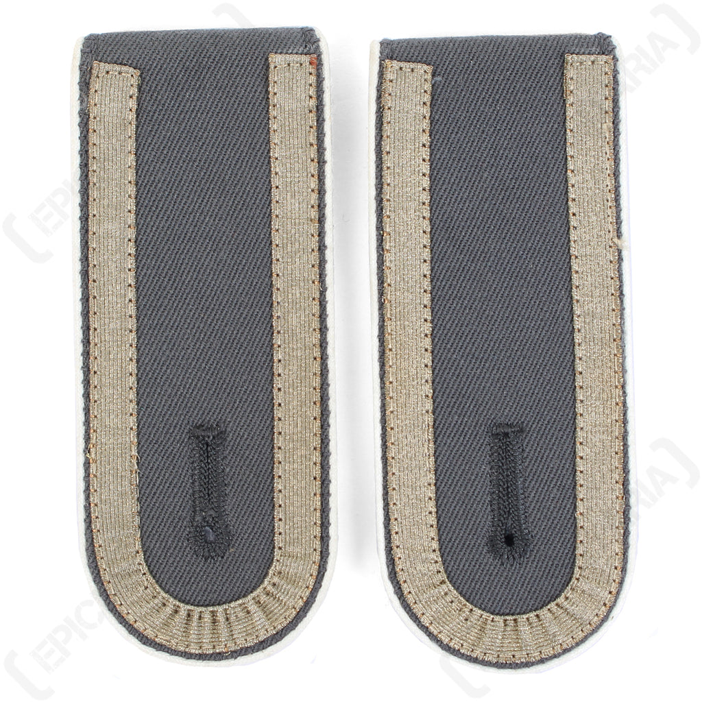 Vintage German Bundeswehr shoulder boards for Unteroffizier featuring white piping accents and woven grey tresse.