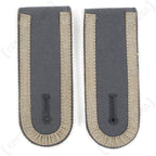 Vintage German Bundeswehr shoulder boards for Unteroffizier featuring white piping accents and woven grey tresse.