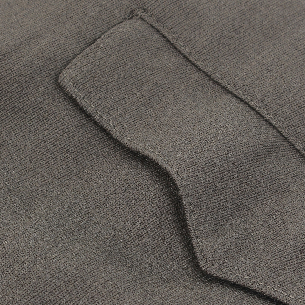 Macro detail shot of the durable wool-mix texture and sturdy stitching on a pocket flap of the authentic German Officer jodhpurs.