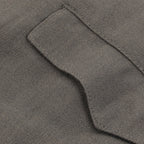 Macro detail shot of the durable wool-mix texture and sturdy stitching on a pocket flap of the authentic German Officer jodhpurs.