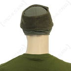 Rear angle of the German Army winter cap with the soft fleece-lined ear flaps folded upwards.
