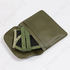 Folded WW2 style Panzer goggles resting inside their olive green protective storage case with a textured finish.
