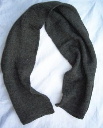 Authentic dark grey German Army wool scarf in a classic ribbed knit, displayed on a soft white background to highlight the durable military surplus texture.