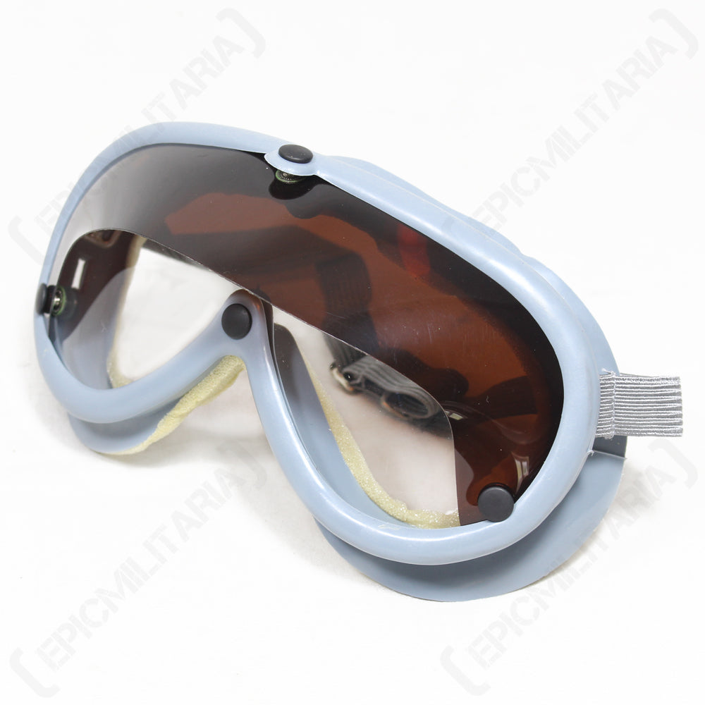 Original Bundeswehr dust goggles with a light grey frame and tinted brown lens, featuring a durable, contoured design for military protection.