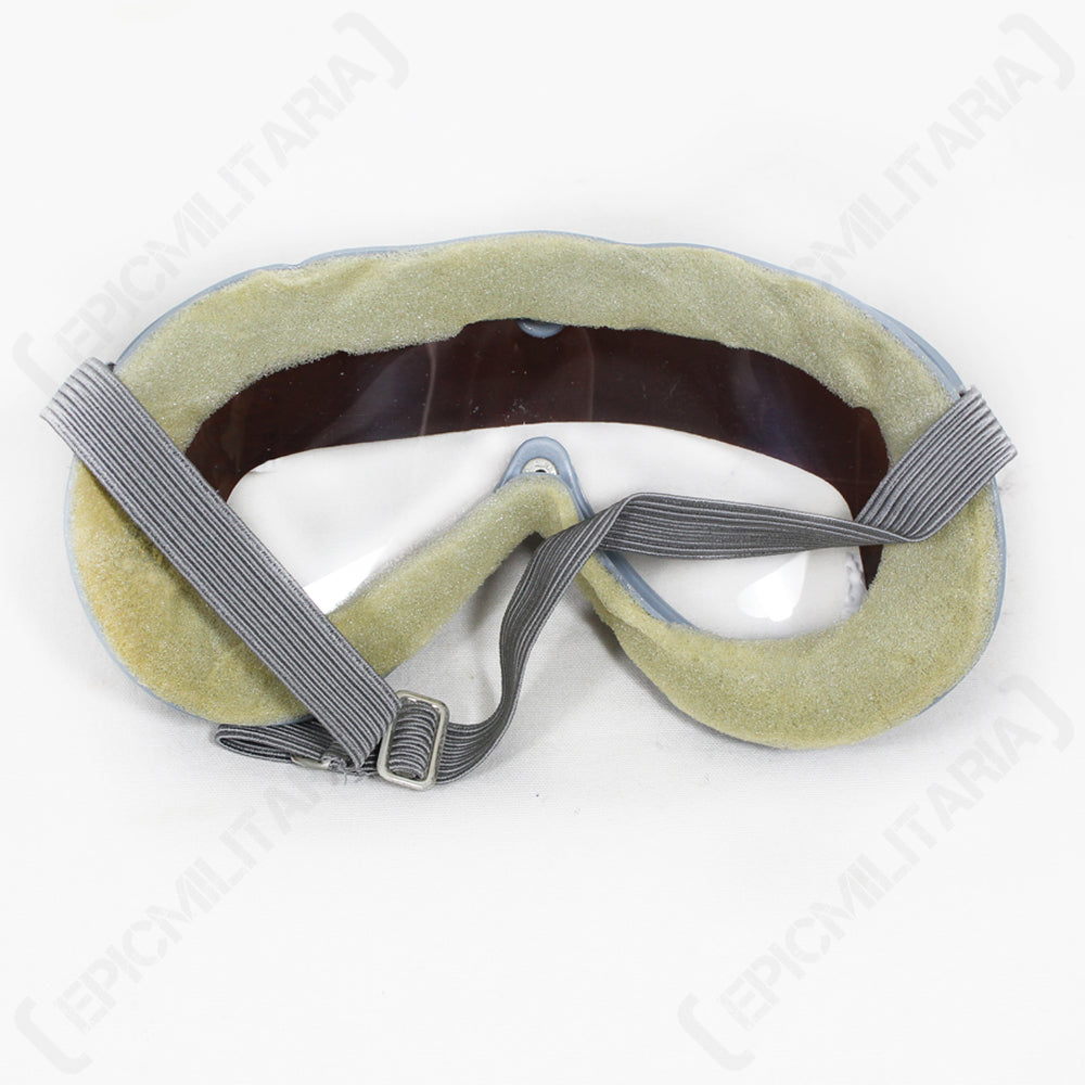 Rear view of vintage German military goggles showing the thick, soft face padding and an adjustable grey elastic strap with a metal buckle for a secure fit.