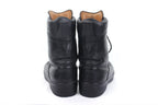 Rear view of a pair of German Army combat boots showcasing the heel flex zone for improved comfort during marches.