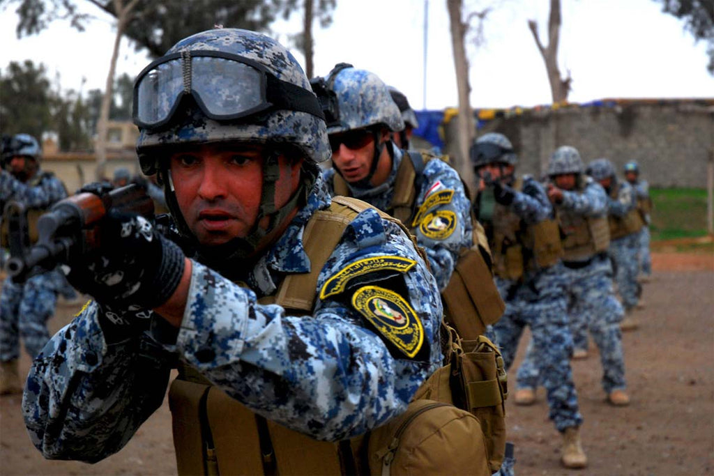 Iraqi Police officers in active training wearing the blue digital camo uniform and tactical gear, demonstrating the pattern in field conditions.