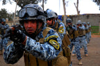 Iraqi Police officers in active training wearing the blue digital camo uniform and tactical gear, demonstrating the pattern in field conditions.
