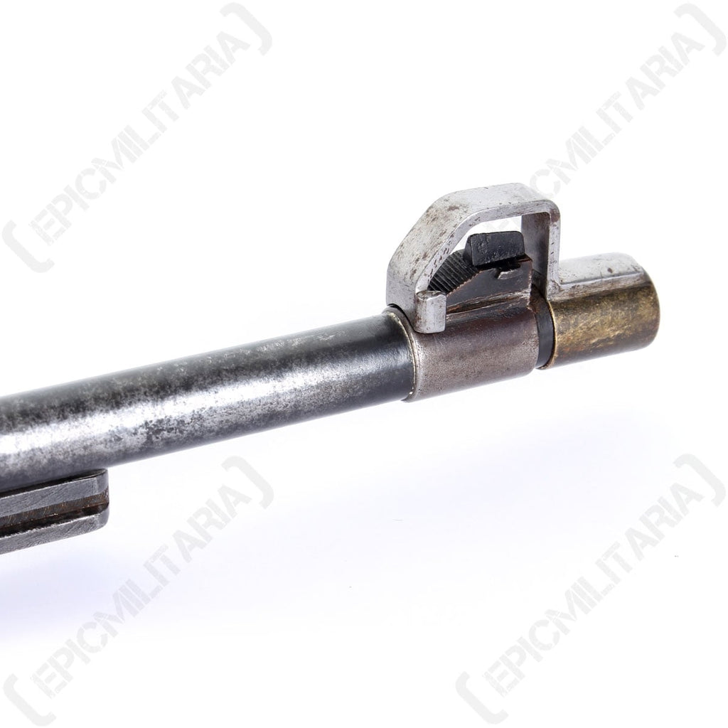 Mauser 1935 muzzle cover securely fitted over the front sight of a rifle barrel.