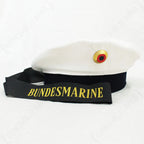Original Bundesmarine EM Tellermütze sailor cap in white and dark blue with gold lettering on the black tally.