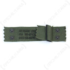 Original Vietnam War M1 helmet liner nape strap with olive-drab canvas webbing, steel studs, adjustable buckle, and visible DSA contract markings.