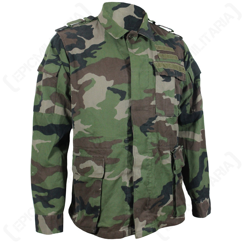 Front view of Original M97 Slovakian woodland camo field jacket with chest pockets, shoulder epaulettes, and velcro insignia panels.