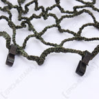 Macro shot showcasing the metal edge clips on the East German NVA helmet net designed for secure attachment to gear.