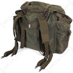 Angled rear perspective of the vintage Austrian olive drab rucksack, showcasing the military-grade strap attachment system.