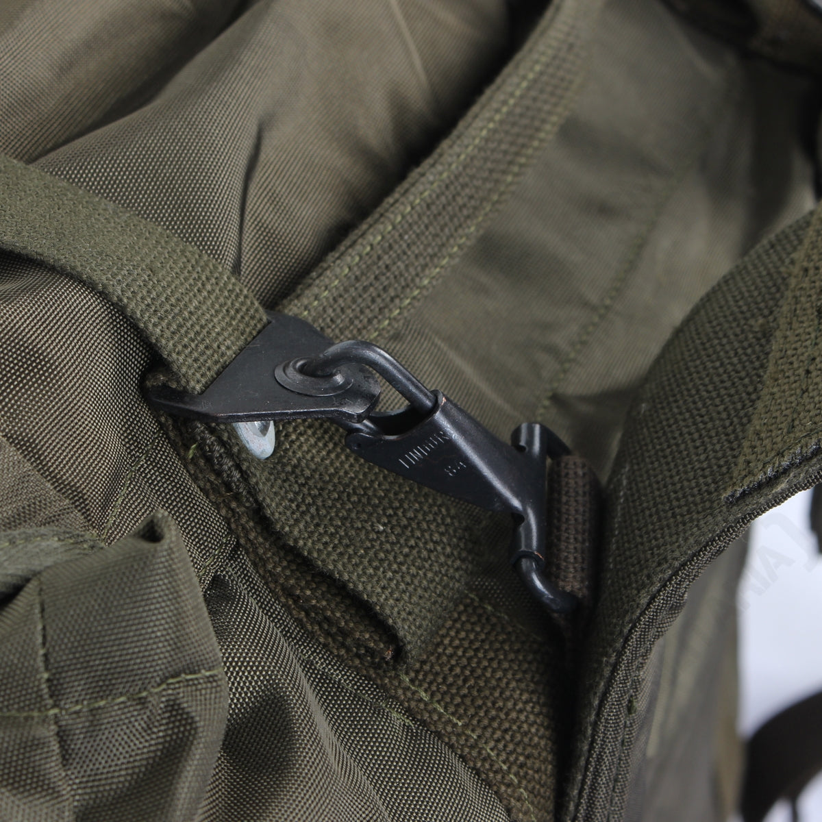 Detail view showing the heavy-duty metal quick-release attachment points for the Austrian rucksack shoulder harness.