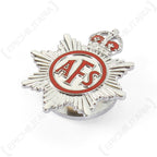 Angled side view of the silver Auxiliary Fire Service lapel badge highlighting the raised King's Crown and eight-pointed star design.