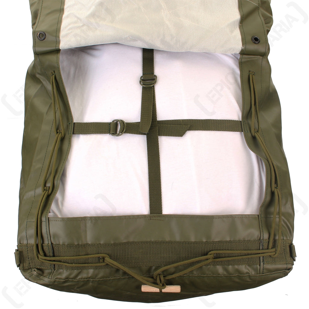 Interior view of the lower gear compartment showing adjustable compression straps and metal buckles.