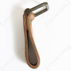 Side profile view of durable Czech surplus leather belt loop highlighting the folded leather design and secure metal D-ring attachment point.