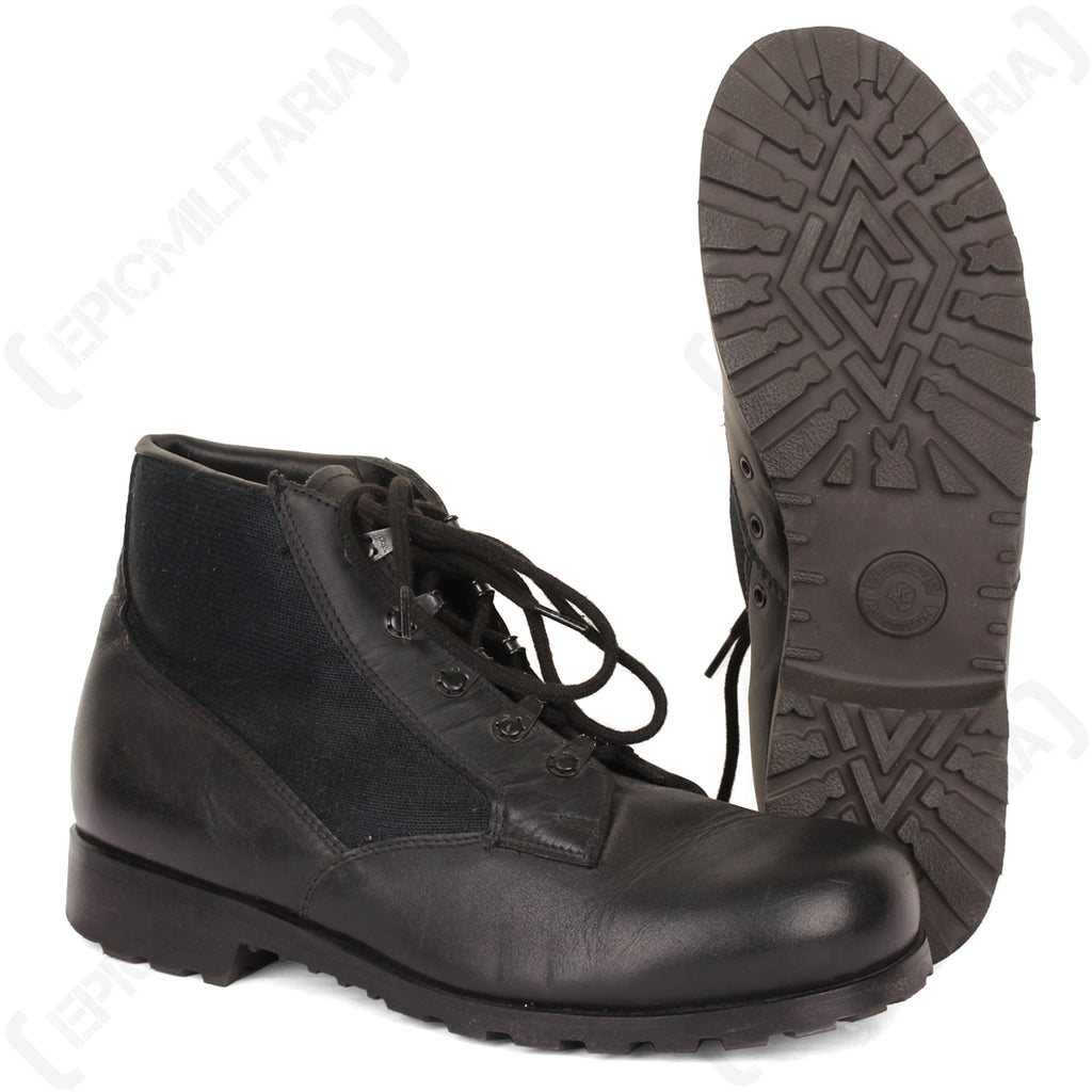 Original German Navy deck shoe in black leather and canvas, displayed beside its thick, deep-treaded rubber outsole.