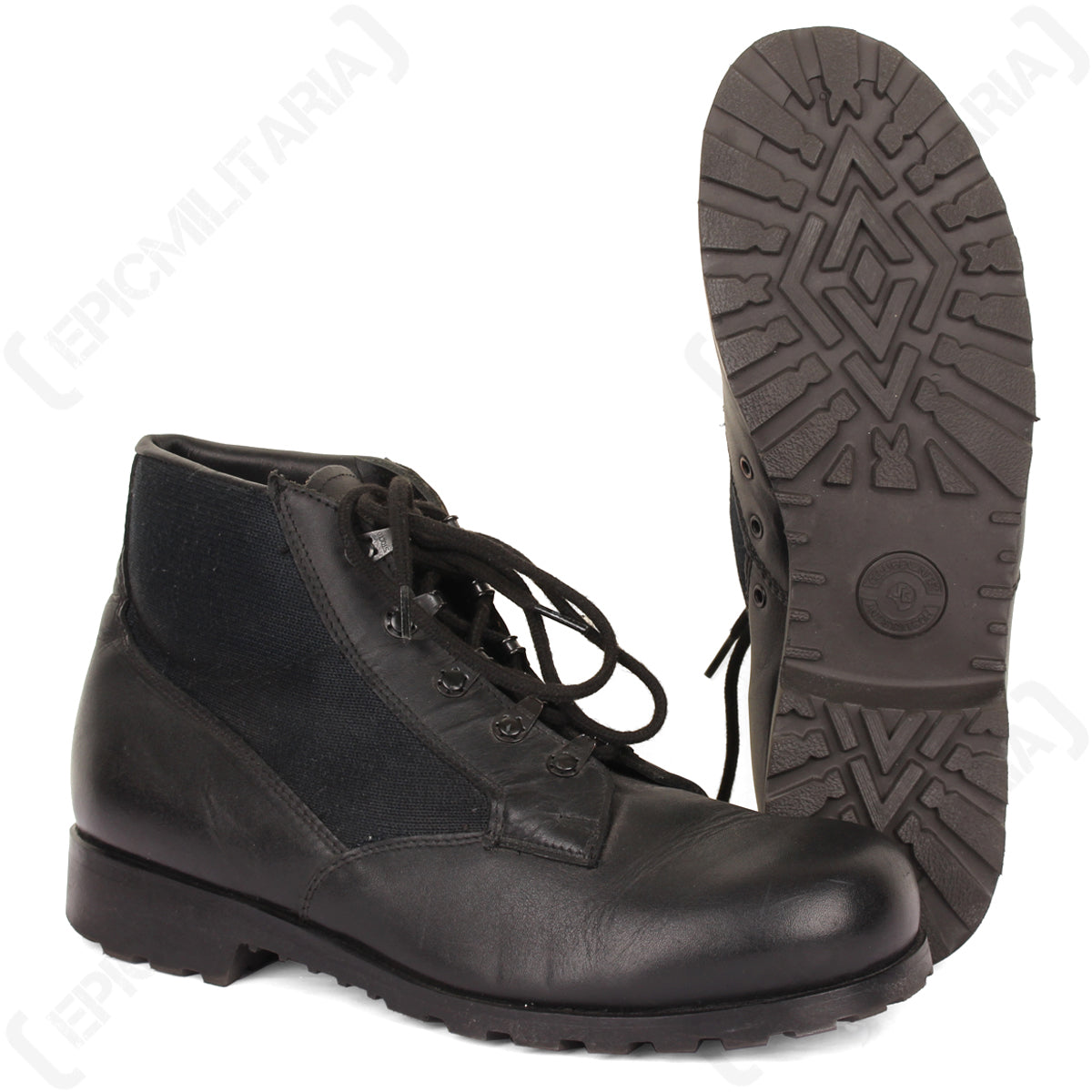 Original German Navy deck shoe in black leather and canvas, displayed beside its thick, deep-treaded rubber outsole.