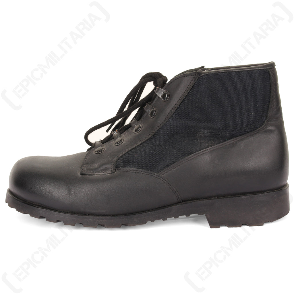 Lateral view of the original German Navy deck boot, showing the utilitarian design, black lace-up system, and reinforced rubber sole.