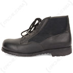 Lateral view of the original German Navy deck boot, showing the utilitarian design, black lace-up system, and reinforced rubber sole.