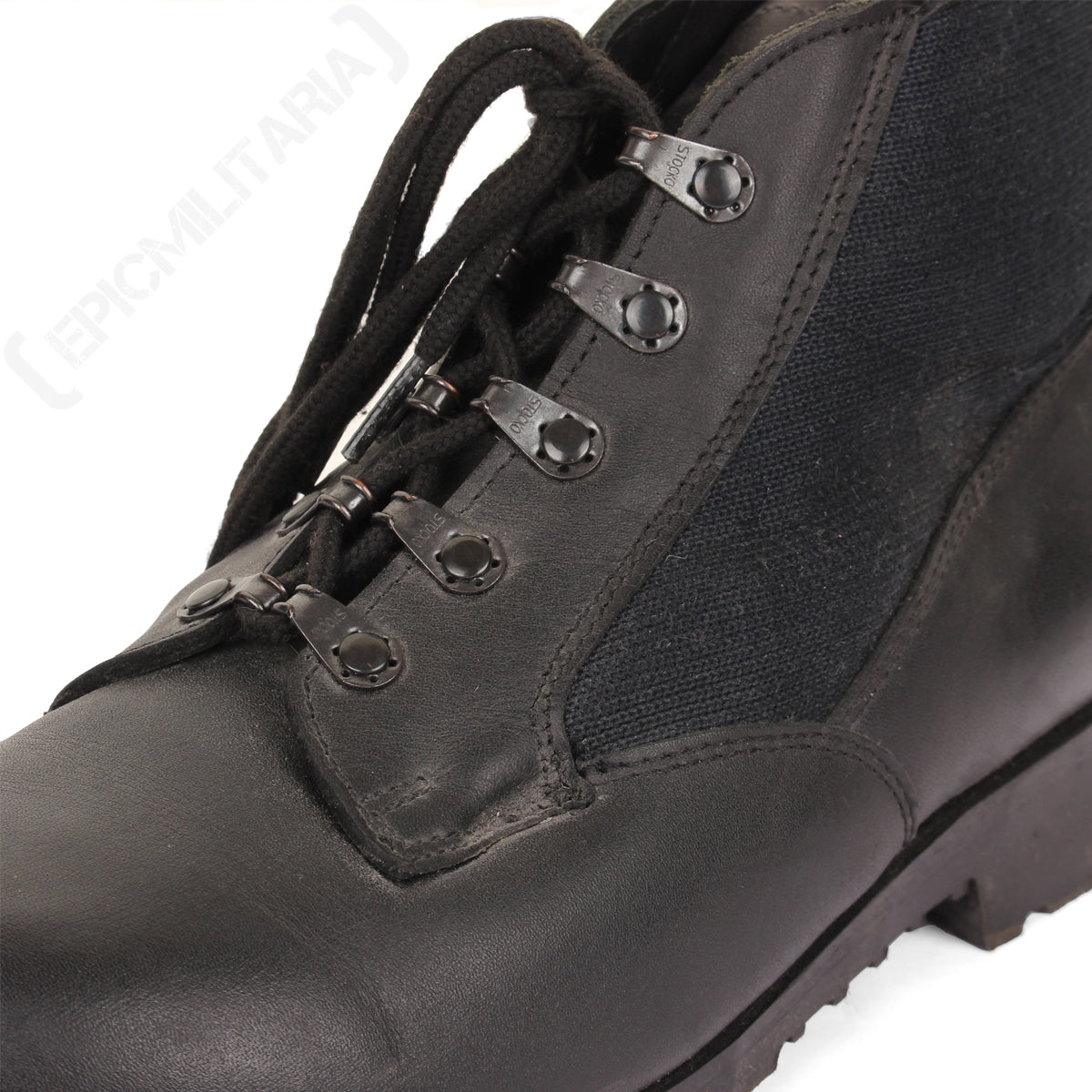 Close-up of a German Navy deck boot's lacing system, featuring black laces and reinforced metal eyelets with Stocko branding.