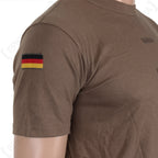 Close-up side profile of the German military t-shirt displaying a German flag patch sewn onto the sleeve.