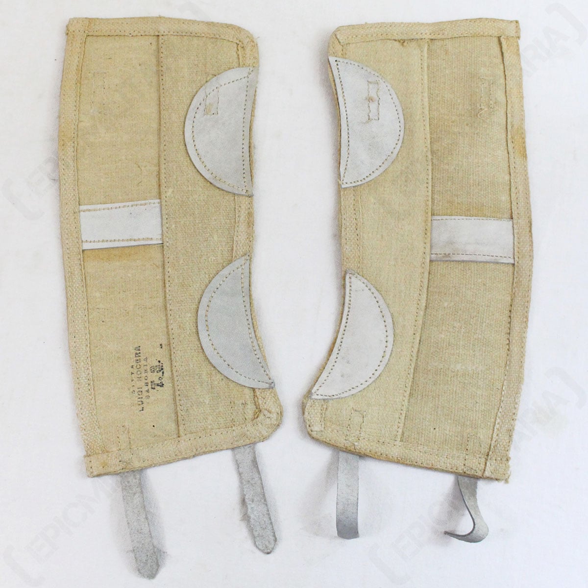 Pair of original Italian Army gaiters showing inner khaki cotton canvas with grey leather reinforcement patches and foot straps.