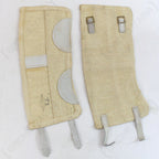 Two original Italian Army gaiters showing one side with leather reinforcement patches and the other side with functional metal buckles.