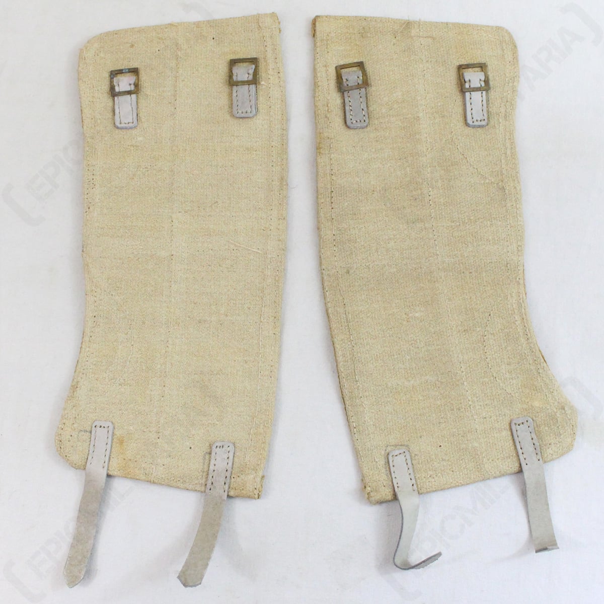 Reverse side of Italian Army canvas gaiters displaying metal buckles for secure adjustable fit and bottom leather attachment hooks.