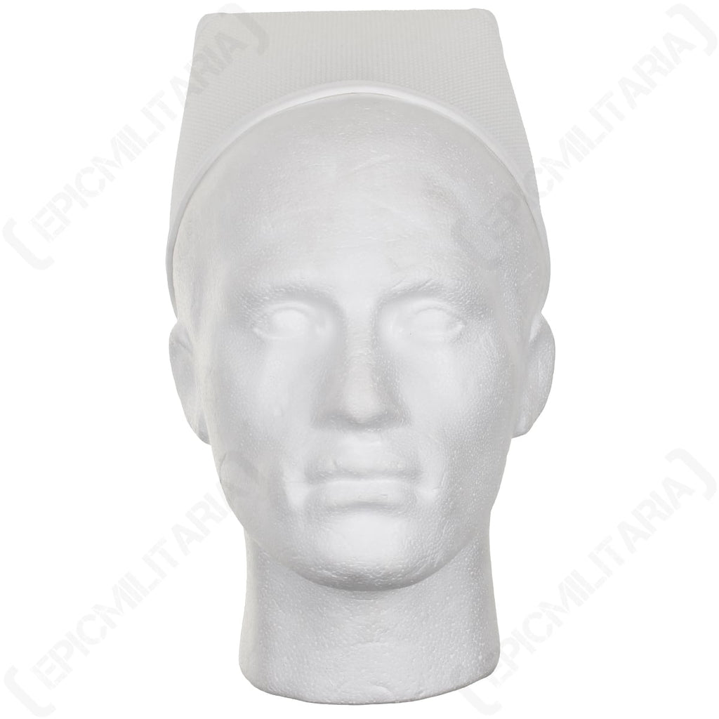Front view of the classic white nurses cap worn on a mannequin, highlighting its historical silhouette.