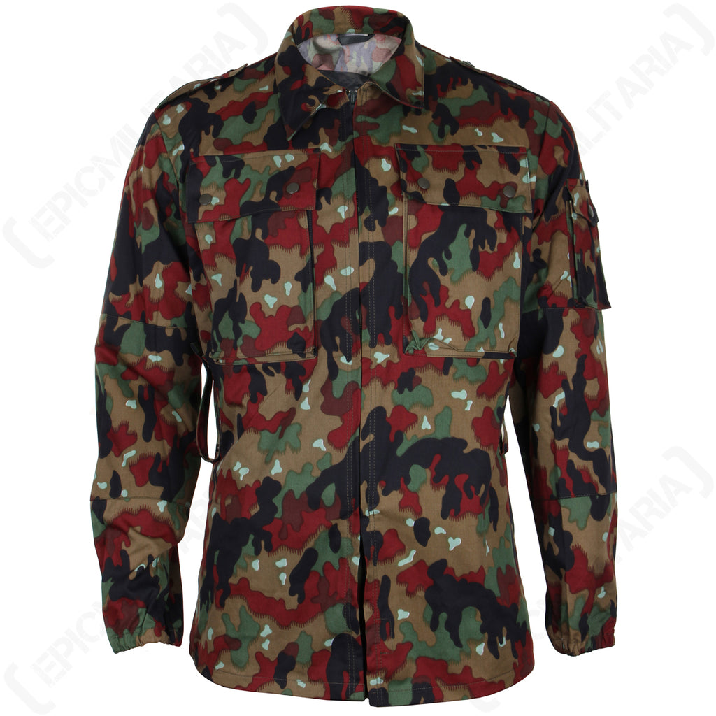 Front view of the Swiss M83 Alpenflage field jacket featuring an iconic six-colour woodland camouflage pattern, buttoned chest pockets, and durable military surplus construction.