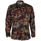 Front view of the Swiss M83 Alpenflage field jacket featuring an iconic six-colour woodland camouflage pattern, buttoned chest pockets, and durable military surplus construction.