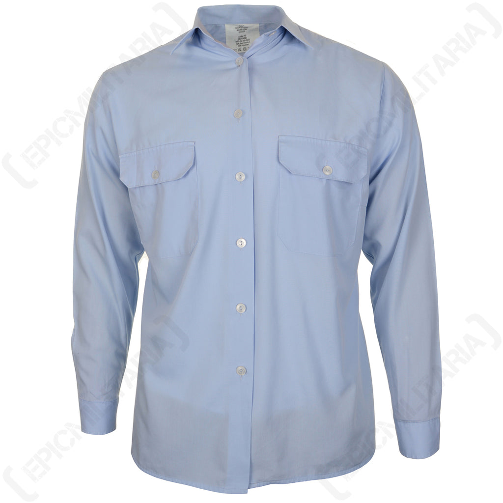 Front view of a German surplus light blue service shirt featuring a seven-button front and two spacious button-down chest pockets.