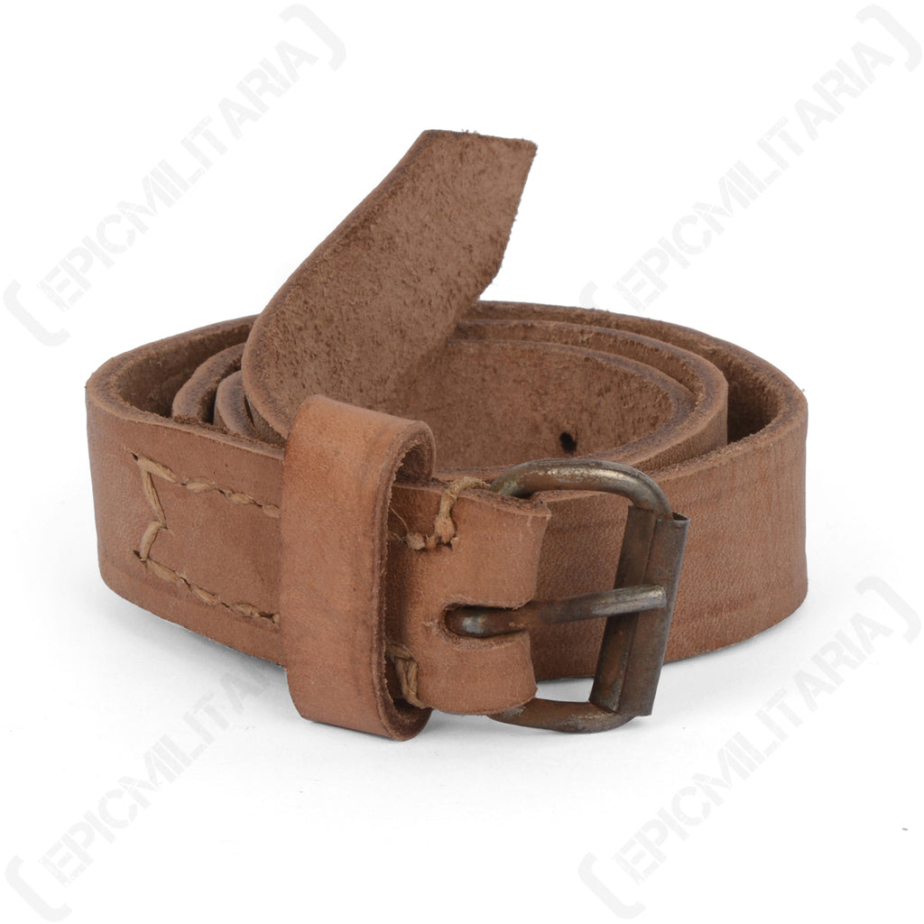 Genuine Polish Army brown leather gear strap coiled with a rustic metal prong buckle.