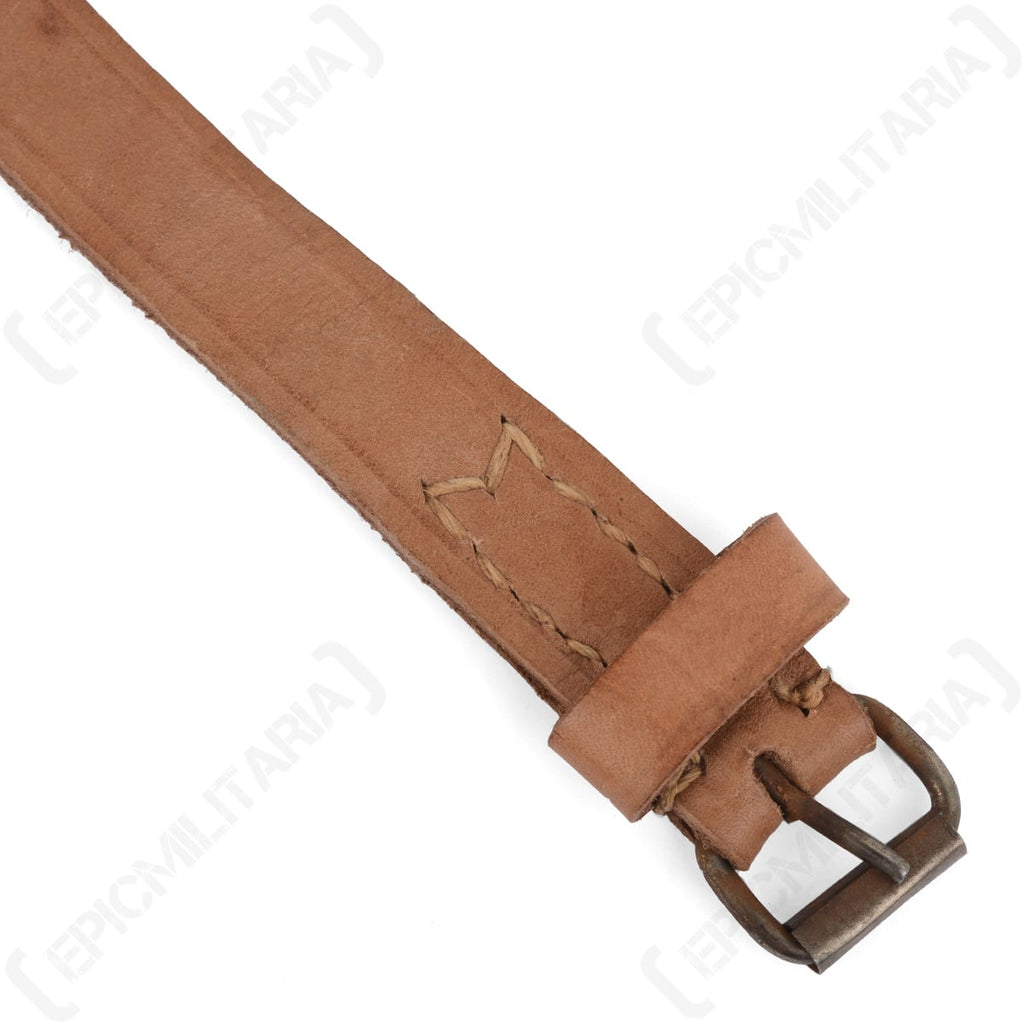 Close-up of the Polish Army leather strap showing detailed stitching reinforcement and the worn metallic prong buckle.