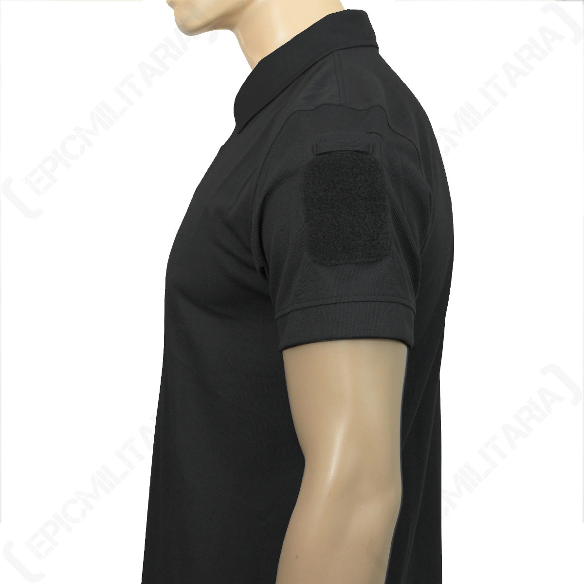 Close-up side profile of the black polo sleeve showing the integrated hook-and-loop patch field.