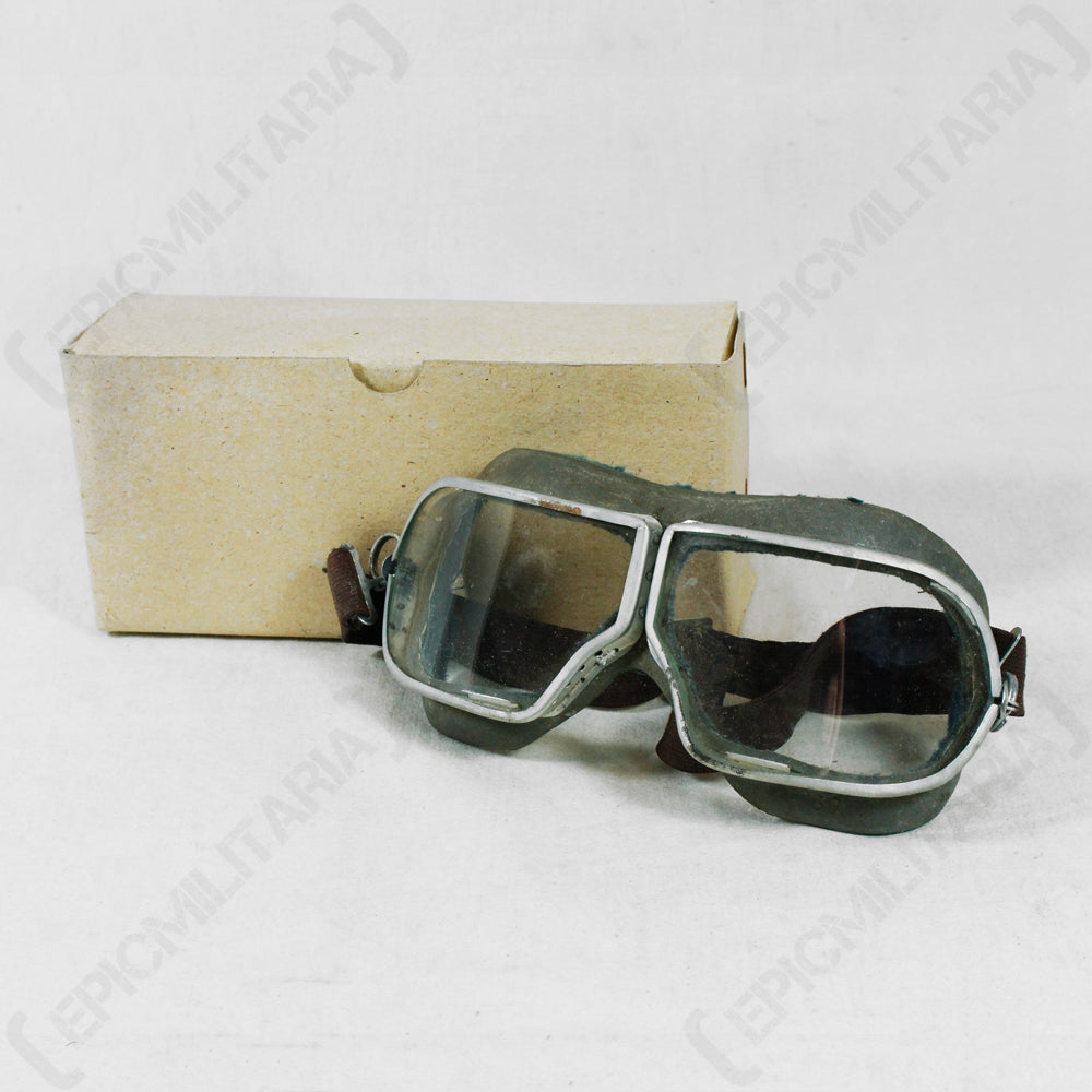 Unused surplus 1938 Pattern Russian pilot goggles in original cardboard packaging, featuring metal eyepieces and rubber frame.