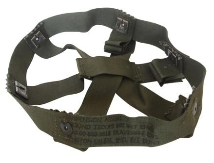 Unissued US military M1 helmet suspension assembly in olive drab with steel connection clips and clear stenciled contract markings on the nylon straps.