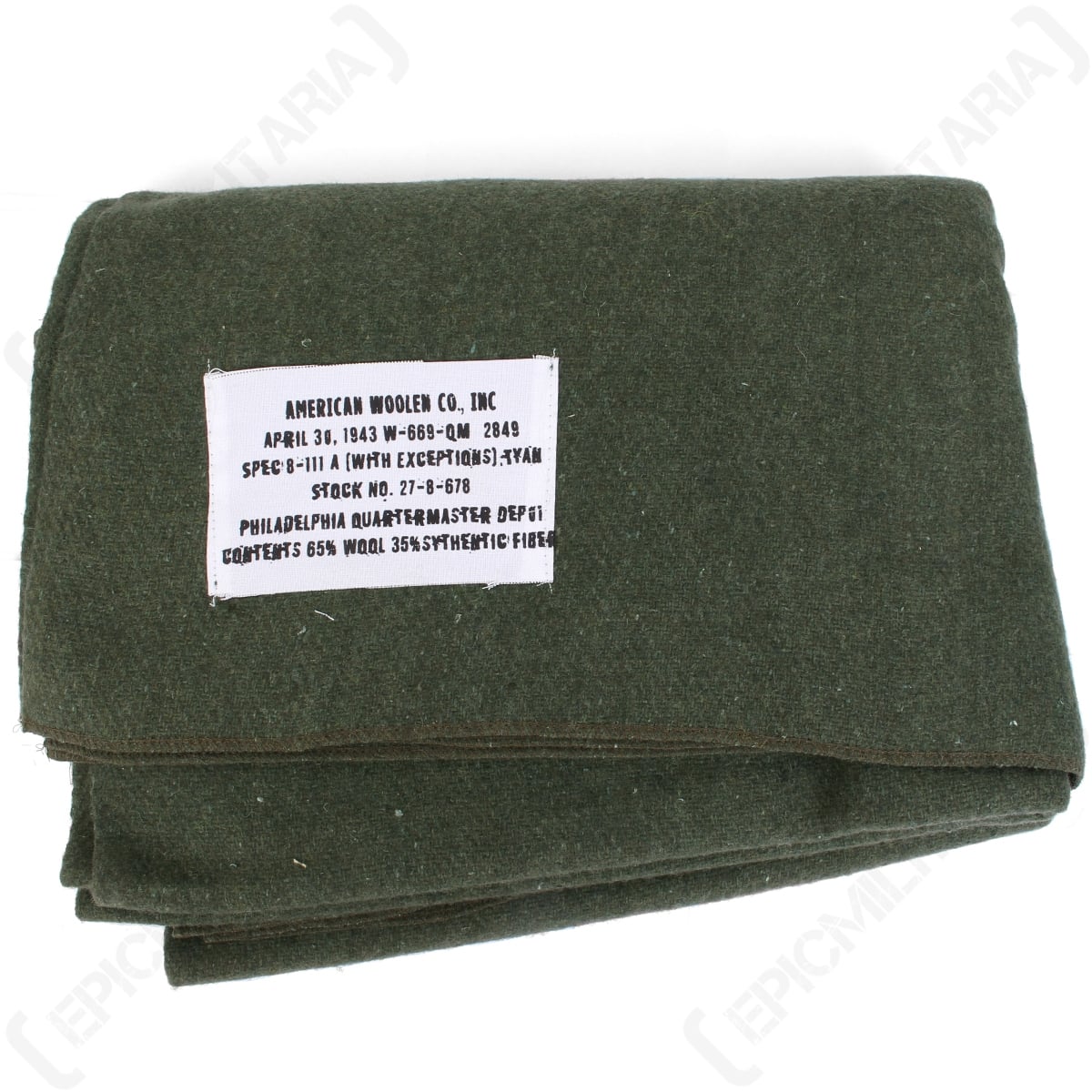 Top-down view of the olive green 1943 US Army reproduction wool blanket showing the official American Woolen Co., Inc. tag.