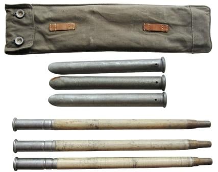 WW2 Swiss Army Zeltbahn tent pole kit showing three sectional wooden poles, three metal tent pegs, and an olive green canvas carrying pack.