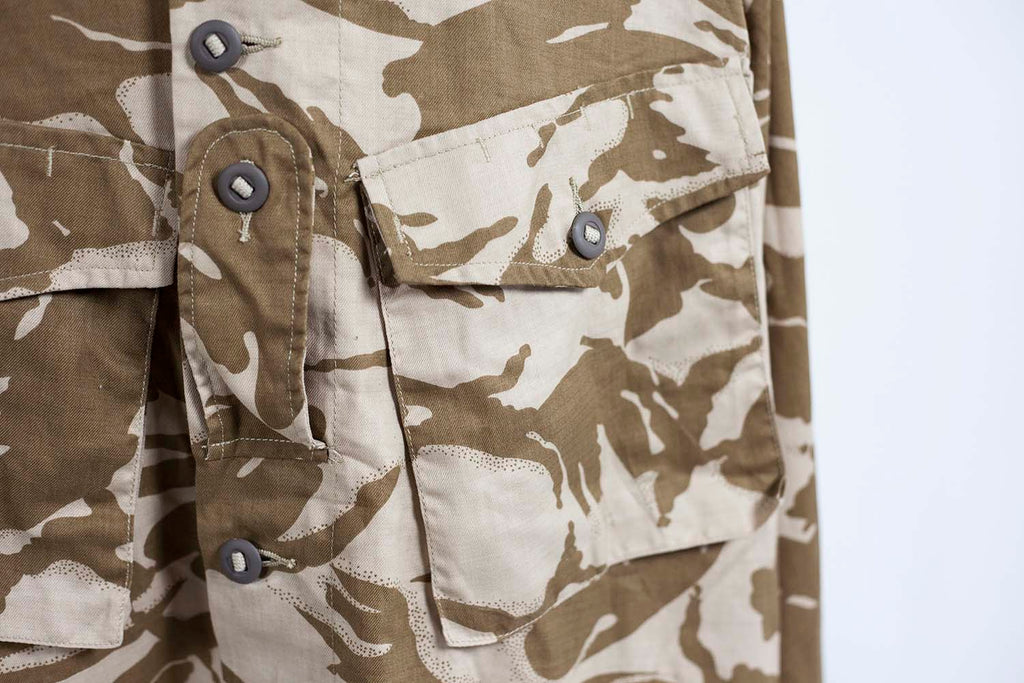 Detail view of the large angled chest pockets and heavy-duty fabric tape used for the Canadian-style buttons.