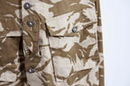 Detail view of the large angled chest pockets and heavy-duty fabric tape used for the Canadian-style buttons.