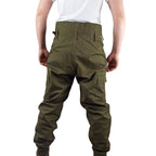 Rear view of authentic Czech cold weather trousers showing the high-back design, fabric waist adjusters, and rugged construction for outdoor activities.