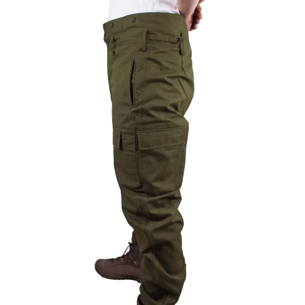 Side profile of Czechoslovakian military over-trousers highlighting the reinforced stitching, deep side hand pockets, and functional cargo pocket design.