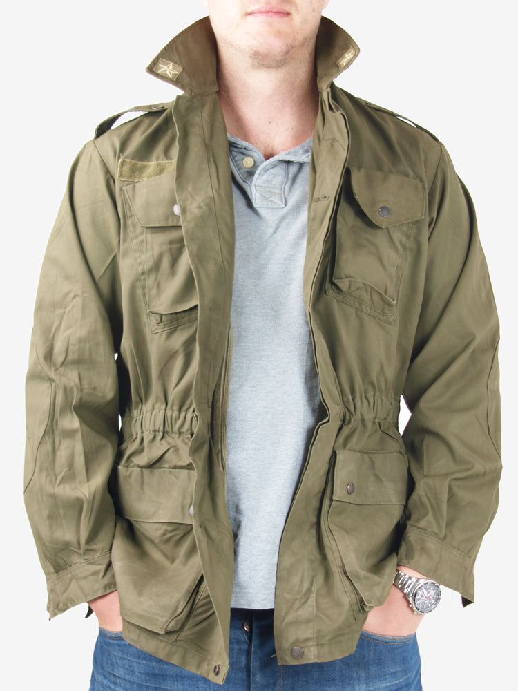 Italian Army olive green field jacket with star insignia on collar and elasticated waist worn over a polo shirt